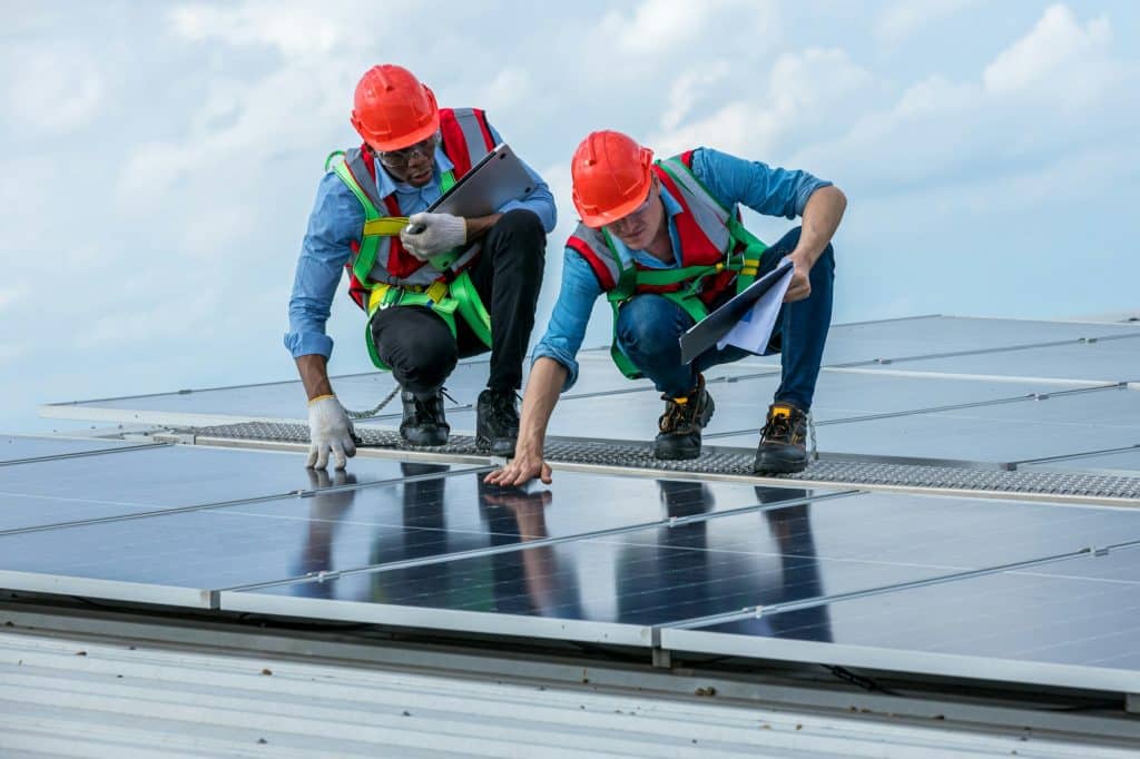 Engineer working setup Solar panel at the roof top. Engineer or worker work on solar panels or solar